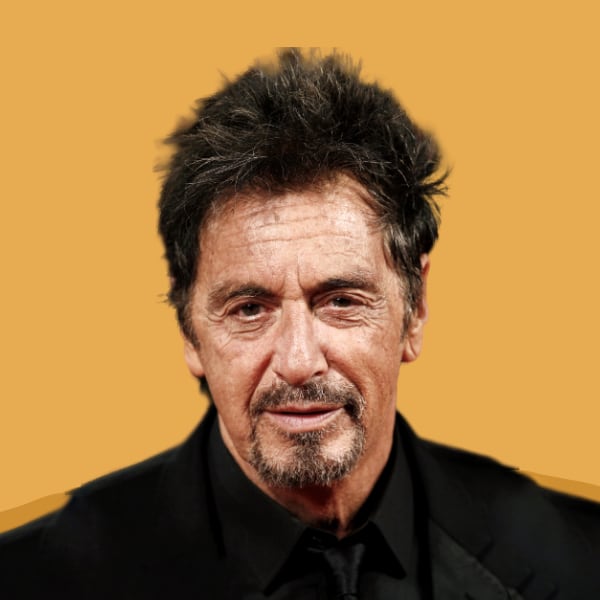 a close up of a person wearing a suit and tie.