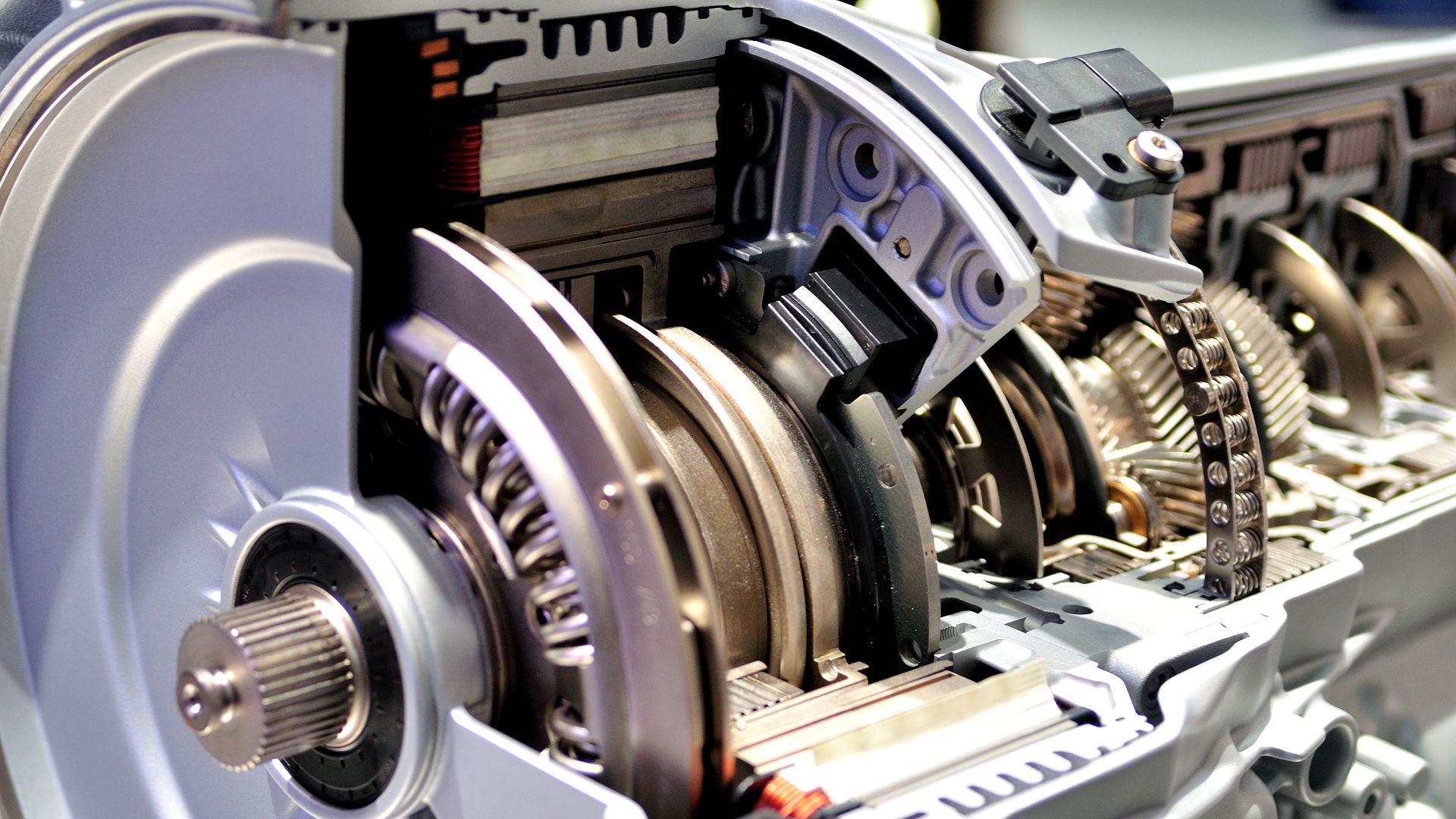 a close up of a mechanical device with gears.|a close up of a car's gear levers.|a close up of a machine with gears.