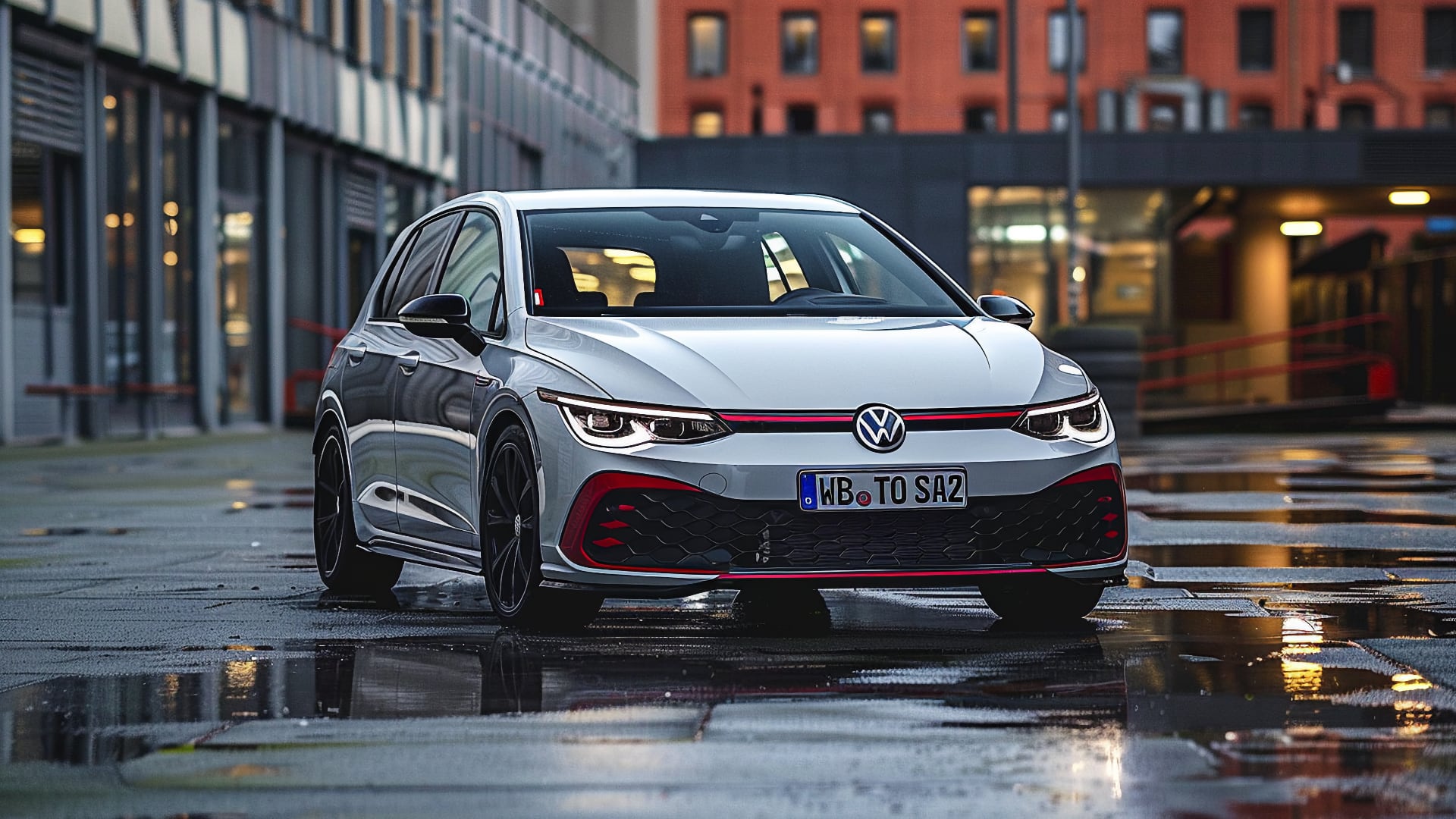 The 2019 Volkswagen Golf GTI, a model year to avoid, is parked on a wet street.|a red car parked on the side of a road.