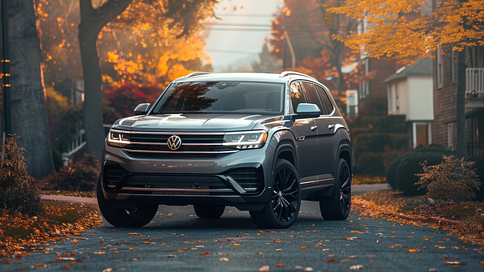 The 2020 VW Atlas, one of the years to avoid, is parked on a street in autumn.|a yellow volkswagen atlaster driving down a country road.