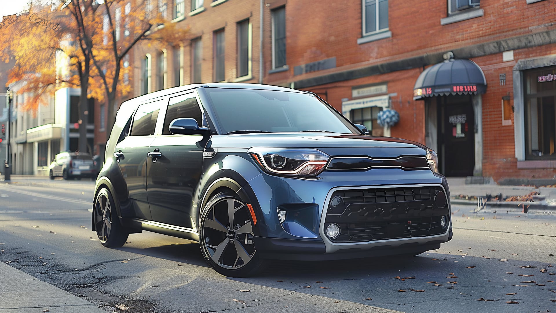 The 2020 Kia Soul is parked on a city street, offering a trendy and stylish choice for urban driving.|a silver car parked on the side of the road.
