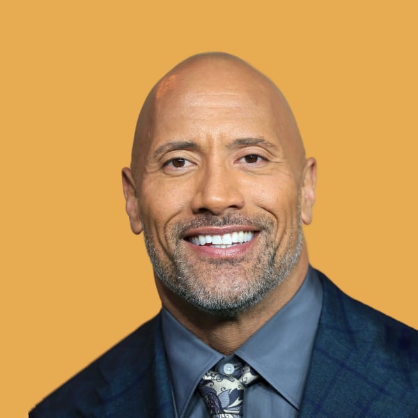 a bald man wearing a suit and tie.