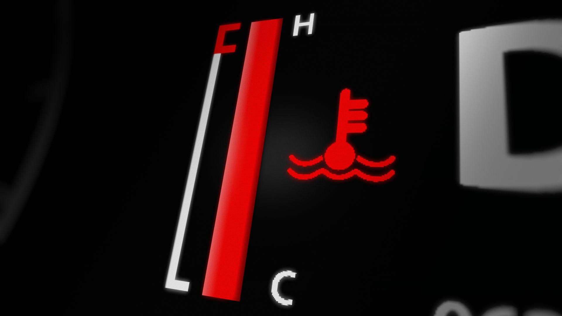 a close up of a car's emblem on a vehicle.|a close up of a person working on an engine.|a person holding a metal object in their hands.
