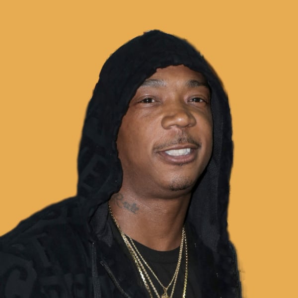 a man wearing a black hoodie and a necklace.