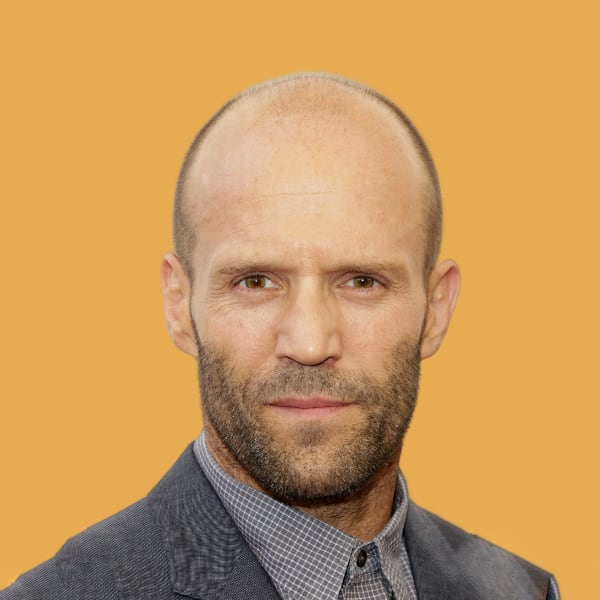 a man with a bald head wearing a suit and tie.