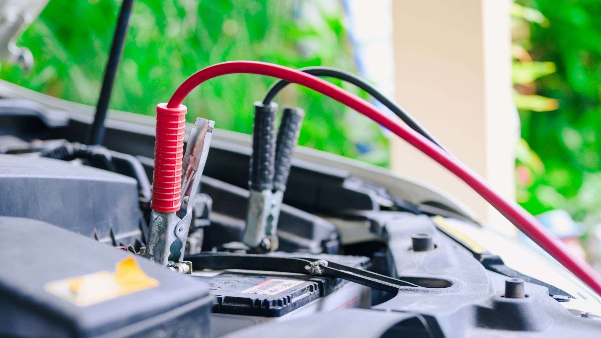 a close up of a car's battery and wires.|a close up of a rusted out fire hydrant.