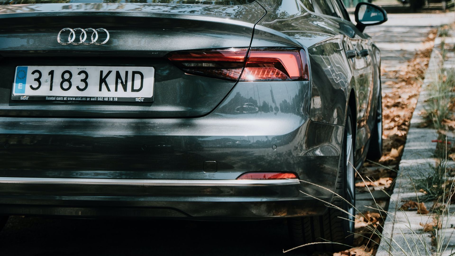 a car parked on the side of the road.|a white mercedes benz benz benz benz benz benz benz benz benz benz benz benz benz.