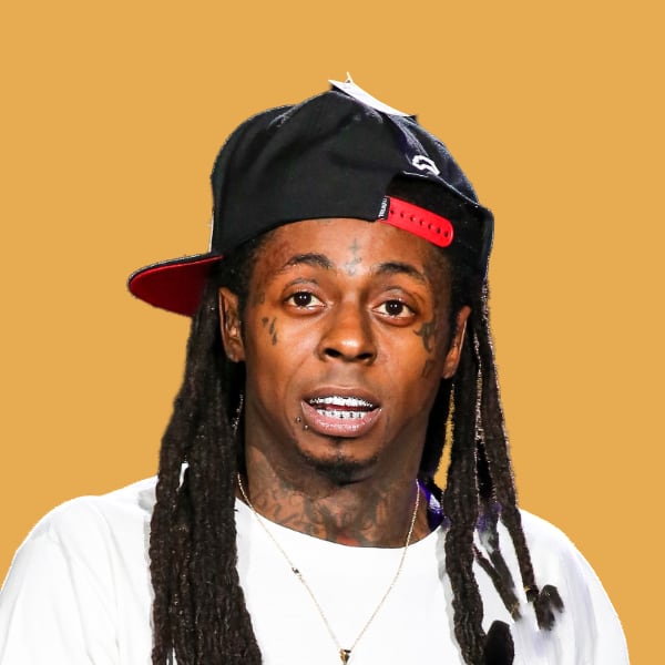 a man with dreadlocks wearing a hat.