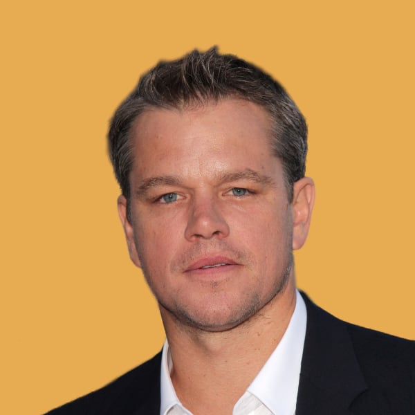 a close up of a person wearing a suit and tie.