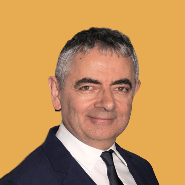 a man in a suit and tie smiling.