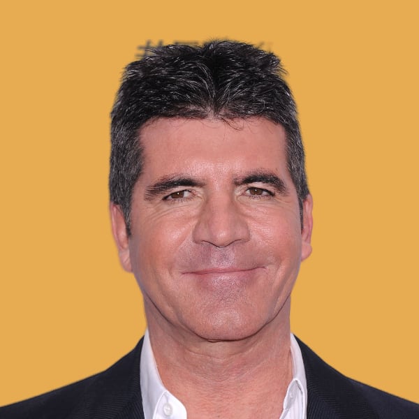a close up of a person wearing a suit and tie.