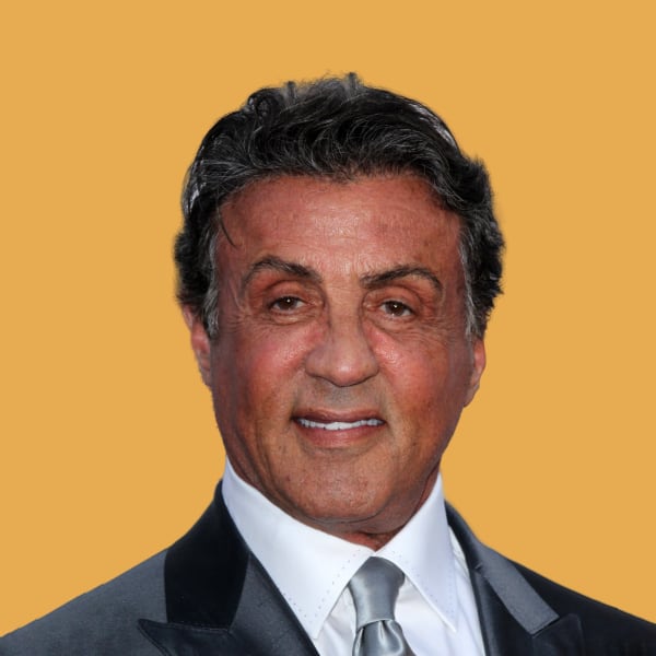 a close up of a person wearing a suit and tie.