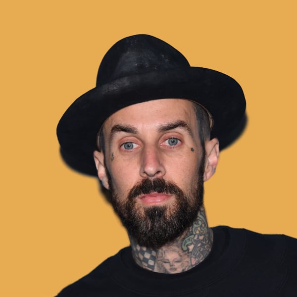 a man with a beard wearing a black hat.|a red sports car parked in front of mountains.
