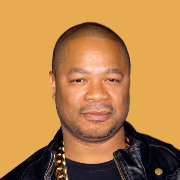 a man in a black shirt and a black jacket.